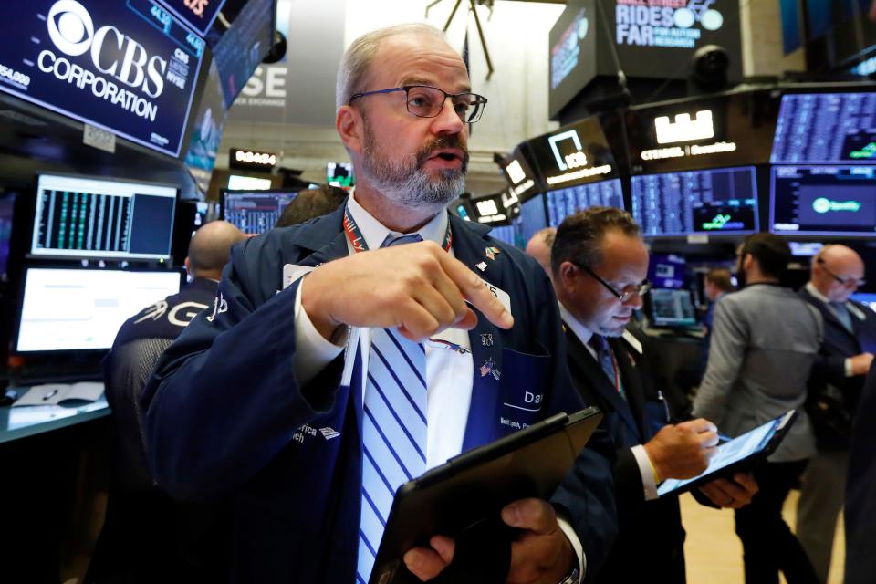 Trader David O'Day works on the floor of the New York Stock Exchange on Aug. 19, 2019. The NYSE has now temporarily closed the floor to prevent the spread of coronavirus.