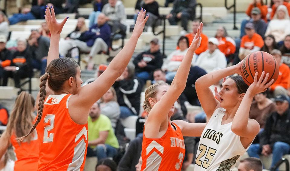 Lapel Bulldogs Taylor Mroz (25) searches to pass the ball against Hamilton Heights Huskies Katie Brown (3) on Tuesday, Dec. 19, 2023, during the game at Lapel High School in Lapel. The Hamilton Heights Huskies defeated the Lapel Bulldogs, 53-41.