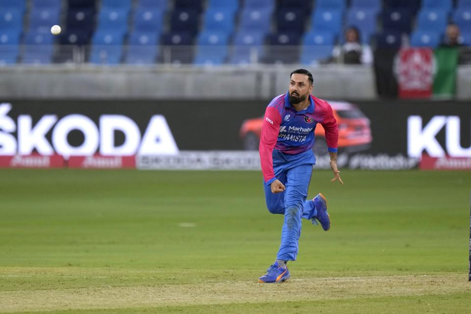 Afghanistan's Mohammad Nabi bowls during the T20 cricket match of Asia Cup between Afghanistan and Sri Lanka, in Dubai, United Arab Emirates, Saturday, Aug. 27, 2022. (AP Photo/Anjum Naveed)