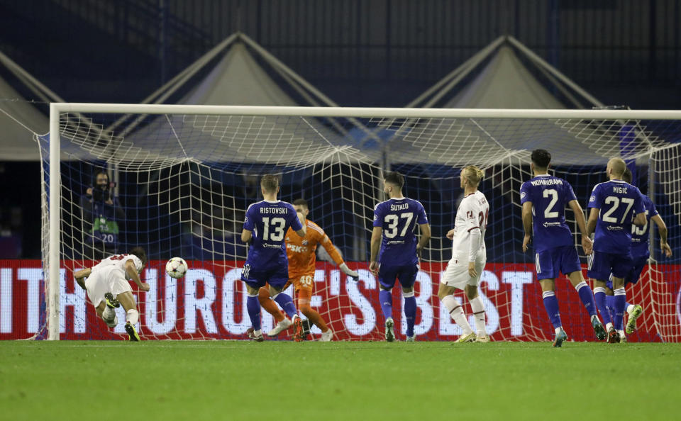 AC Milan's Matteo Gabbia scores his side's opening goal during the Champions League Group E soccer match between Dinamo Zagreb and AC Milan in Zagreb, Croatia, Tuesday, Oct. 25, 2022. (AP Photo)