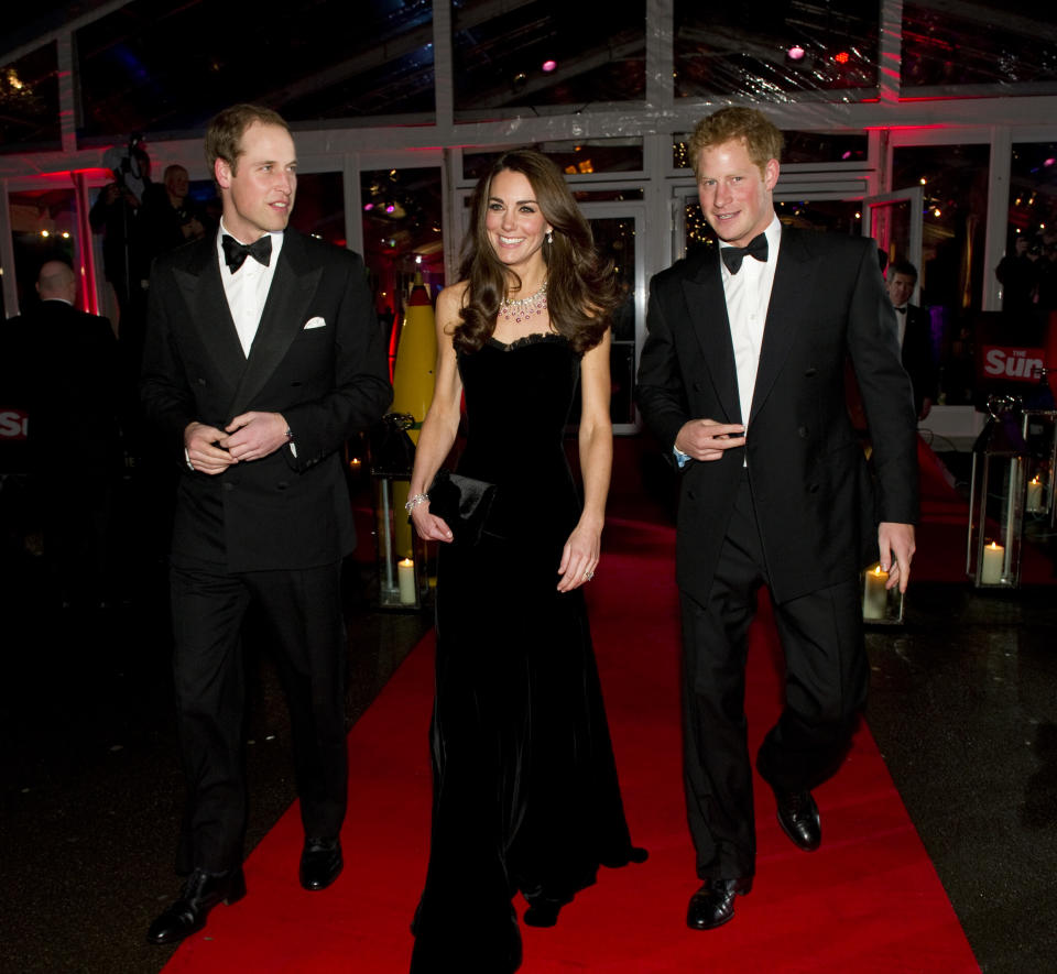 LONDON, ENGLAND - DECEMBER 19: Prince William, Duke of Cambridge, Catherine, Duchess of Cambridge and Prince Harry attend The Sun Military Awards at Imperial War Museum on December 19, 2011 in London, England. (Photo by Arthur Edwards - WPA Pool/Getty Images)