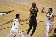 Chicago Bulls guard Zach LaVine (8) passes the ball away from Denver Nuggets forward Michael Porter Jr. (1) and center Nikola Jokic (15) during the first half of an NBA basketball game Monday, March 1, 2021, in Chicago. (AP Photo/Matt Marton)