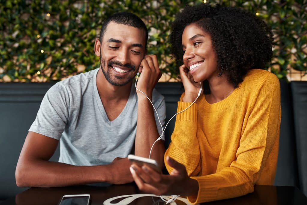 A couple listen to an audiobook from one of their devices.