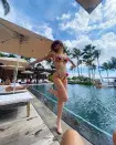 The HBO star was beaming in this moment as she struck a pose in front of a pool while vacationing in O'ahu, Hawaii.