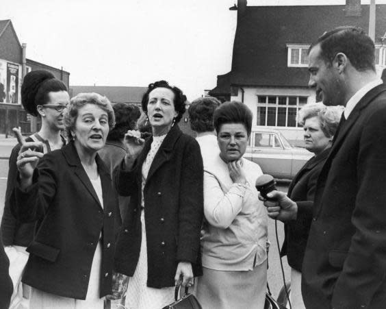 Striking women machinists from the Ford plant at Dagenham are interviewed upon their arrival at Rainham for a meeting with the National Union of Vehicle Builders, 18th June 1968 (Photo by Central Press/Hulton Archive/Getty Images)