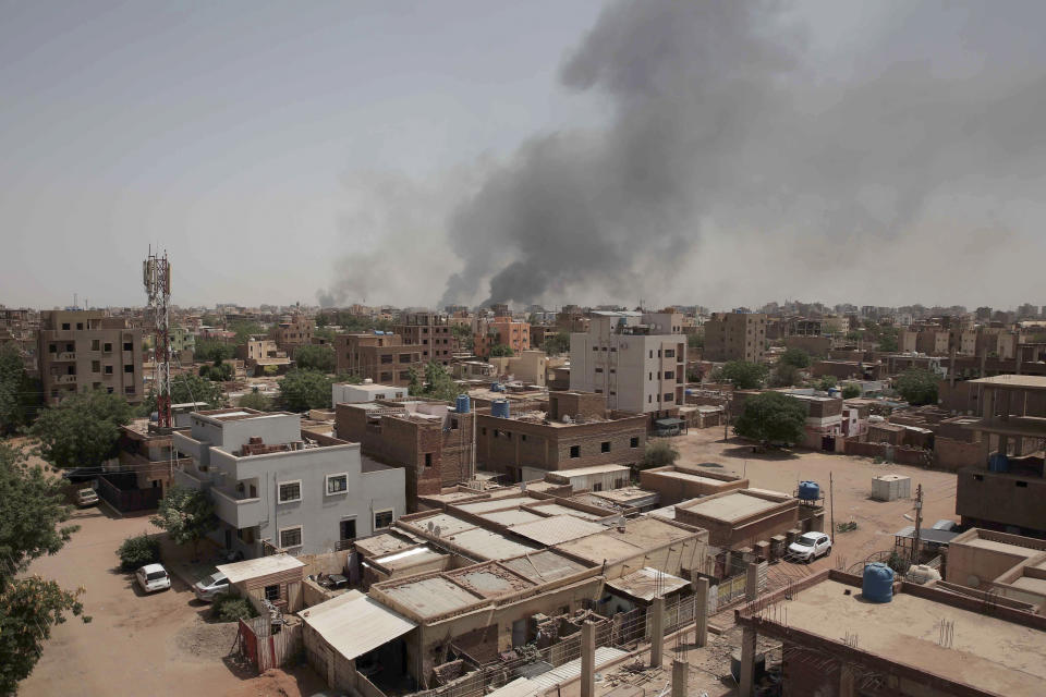 Smoke is seen rising from Khartoum's skyline, Sudan, Sunday, April 16, 2023. The Sudanese military and a powerful paramilitary group battled for control of the chaos-stricken nation for a second day Sunday, signaling they were unwilling to end hostilities despite mounting diplomatic pressure to cease fire. (AP Photo/Marwan Ali)