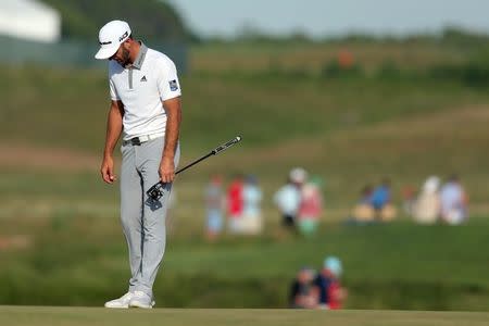 Jun 17, 2018; Southampton, NY, USA; Dustin Johnson reacts on the seventeenth green during the final round of the U.S. Open golf tournament at Shinnecock Hills GC - Shinnecock Hills Golf C. Brad Penner-USA TODAY Sports