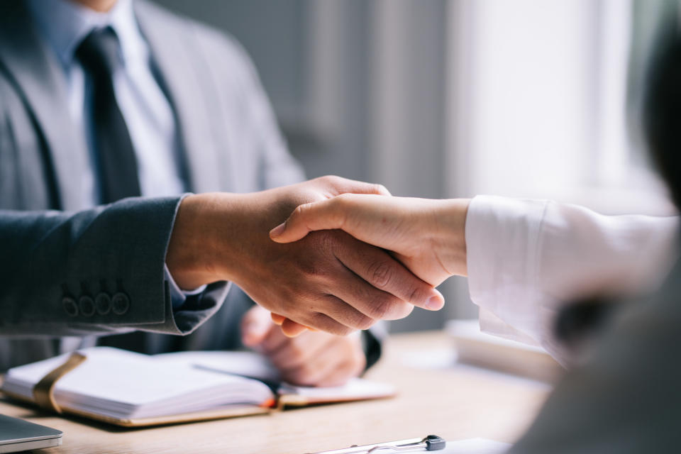 People shaking hands in a job interview