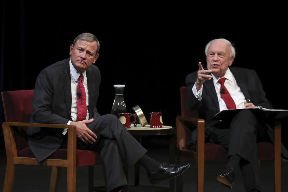 U.S. Supreme Court Chief Justice John Roberts, Jr., left, listen to a student's question following his conversation with Professor Robert A. Stein Tuesday, Oct. 16, 2018 at Northrop Auditorium in Minneapolis. Roberts stressed the need for the judicial branch to remain independent, taking note of the tumultuous debate over the confirmation of Associate Justice Brett Kavanaugh to say that the high court makes mistakes when it yields to political pressures. (Jeff Wheeler/Star Tribune via AP)