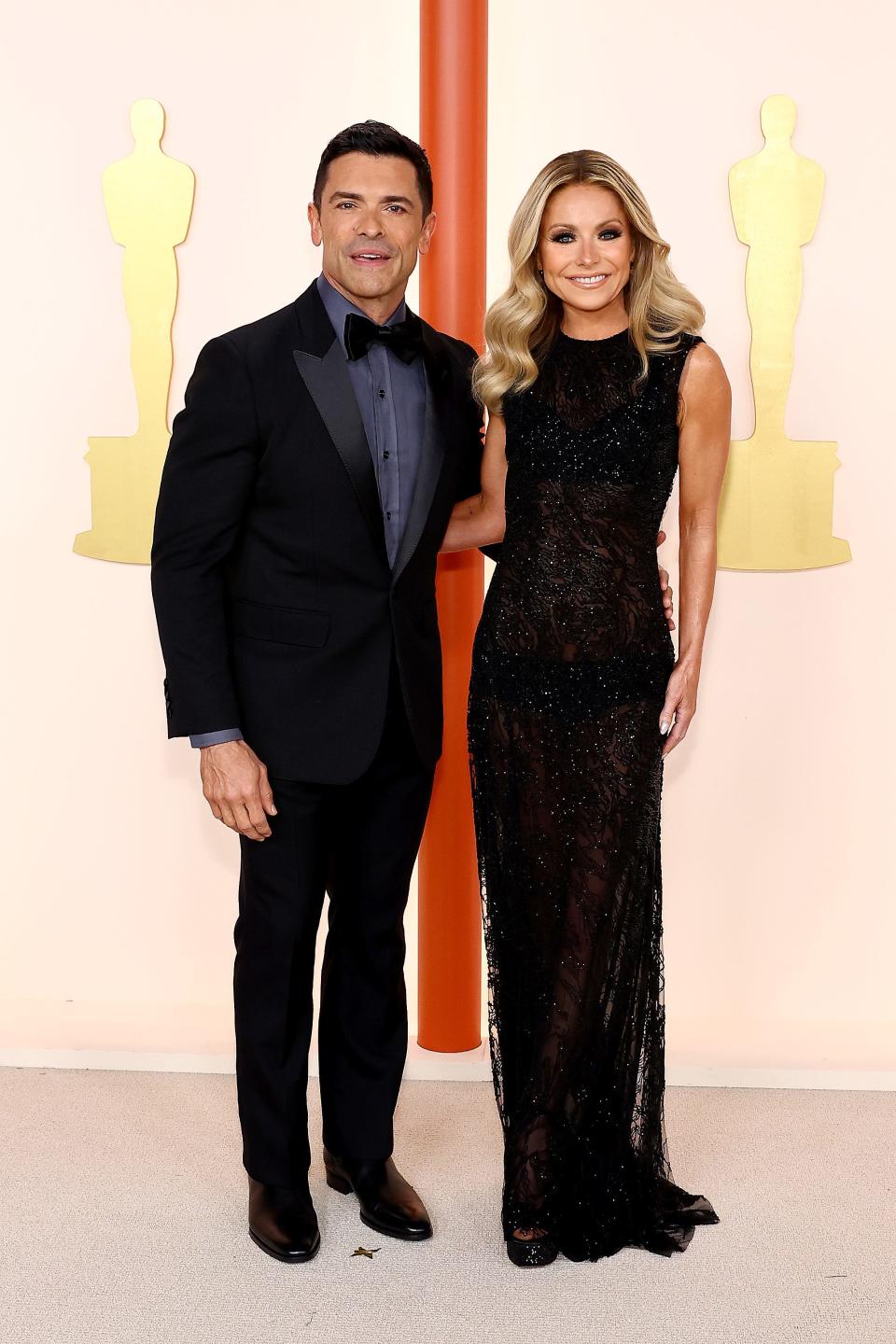 Mark Consuelos and Kelly Ripa attend the 2023 Academy Awards.