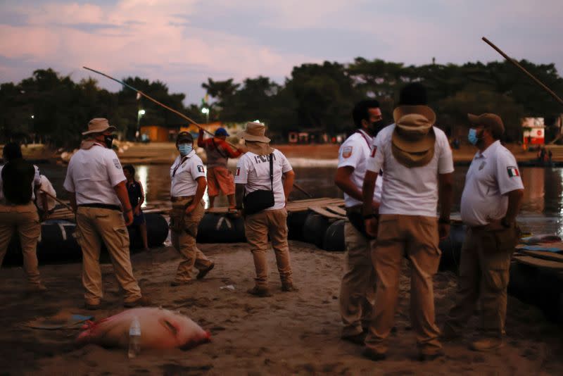 IImmigration agents keep watch at the banks of the Suchiate River, to prevent a migrant caravan of Central Americans from entering, in Ciudad Hidalgo,