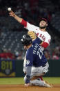 Seattle Mariners' Ty France, below, is forced out at second as Los Angeles Angels second baseman David Fletcher attempts to throw out Mitch Haniger at first during the third inning of a baseball game Friday, Sept. 24, 2021, in Anaheim, Calif. Haniger was safe at first on the play. (AP Photo/Mark J. Terrill)