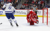 Toronto Maple Leafs center Zach Hyman (11) watches a Morgan Rielly shot go in for a goal on Detroit Red Wings goaltender Jimmy Howard (35) during the first period of an NHL hockey game Thursday, Oct. 11, 2018, in Detroit. (AP Photo/Paul Sancya)