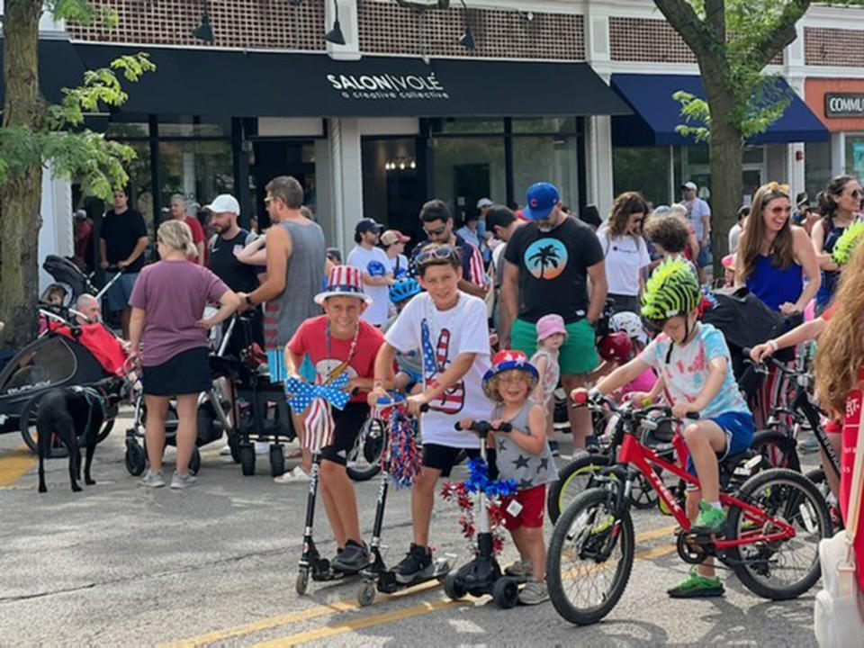 Shawn Coteau's three sons, enjoying the parade minutes before the shooting started. (Courtesy Shawn Cotreau)