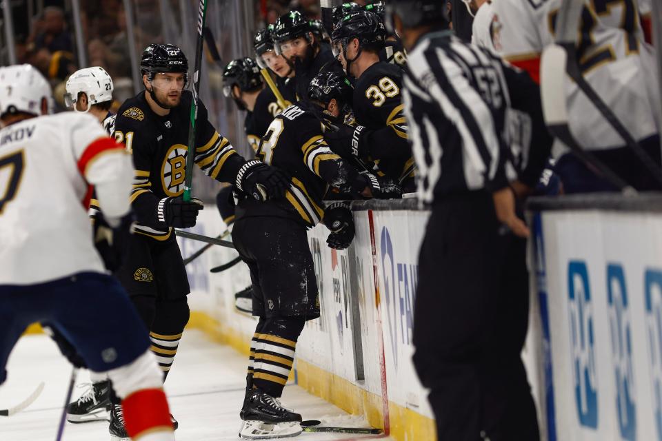 Boston's Brad Marchand (63) struggles to get to the bench after being hit by Florida's Sam Bennett in the first period. Reports say he could return tonight, May 17, for game 6 against the Panthers.