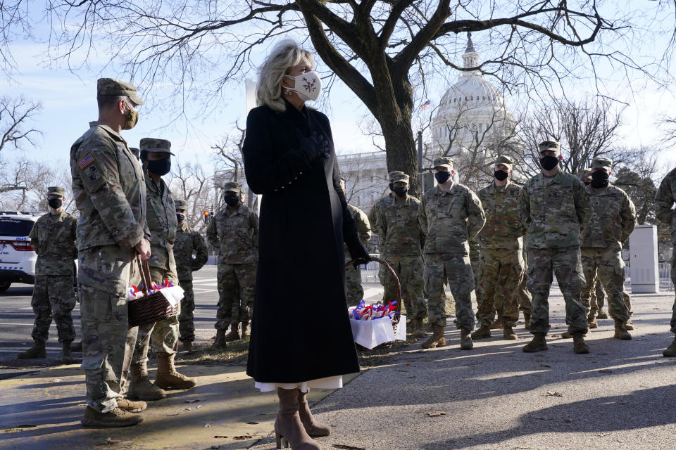 First lady Jill Biden surprises National Guard members outside the Capitol with chocolate chip cookies, Friday, Jan. 22, 2021, in Washington. (AP Photo/Jacquelyn Martin, Pool)