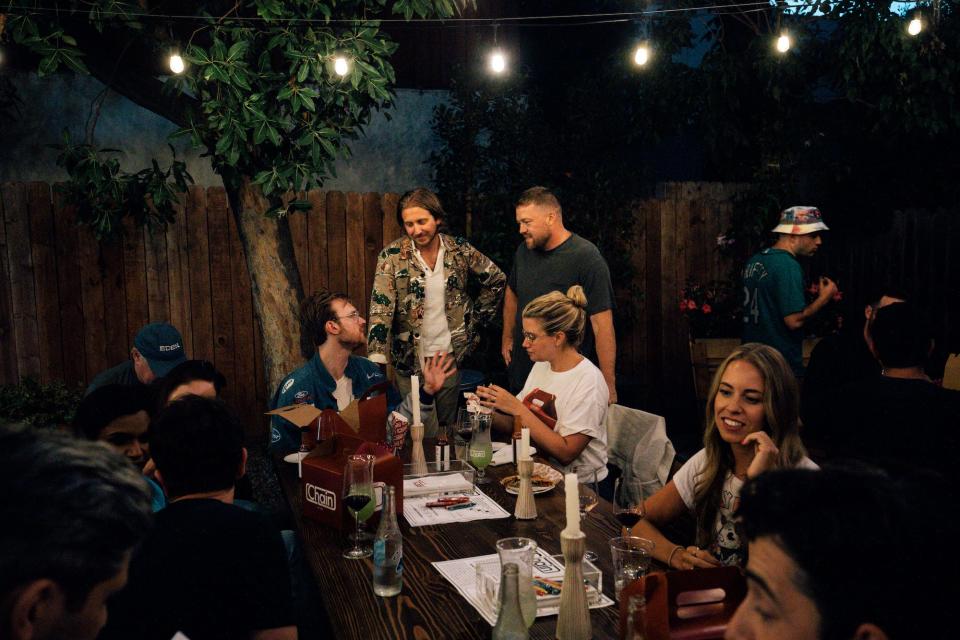 Nicholas Kraft and Chef Tim Hollingsworth chatting with Finneas at the Chain House in West Hollywood.