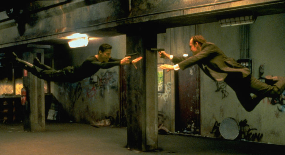Keanu Reeves and Hugo Weaving face each other in a scene from the 1999 movie 'The Matrix'. (Photo by Siemoneit/Sygma via Getty Images)