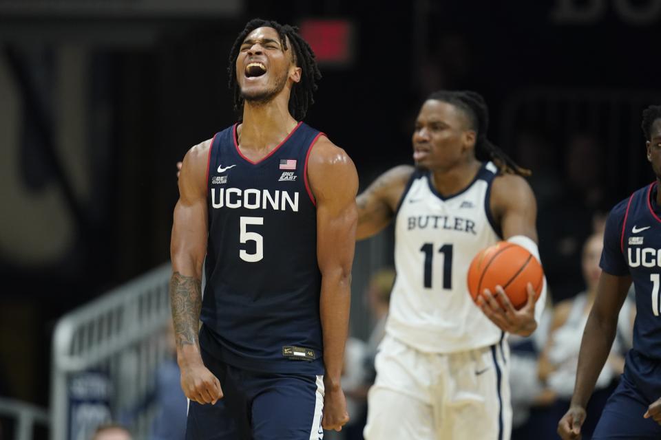 UConn's Stephon Castle (5) reacts after Butler's Jahmyl Telfort (11) was called for a foul during the second half of an NCAA college basketball game Friday, Jan. 5, 2024, in Indianapolis. (AP Photo/Darron Cummings)