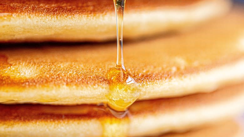Syrup on pancakes upclose