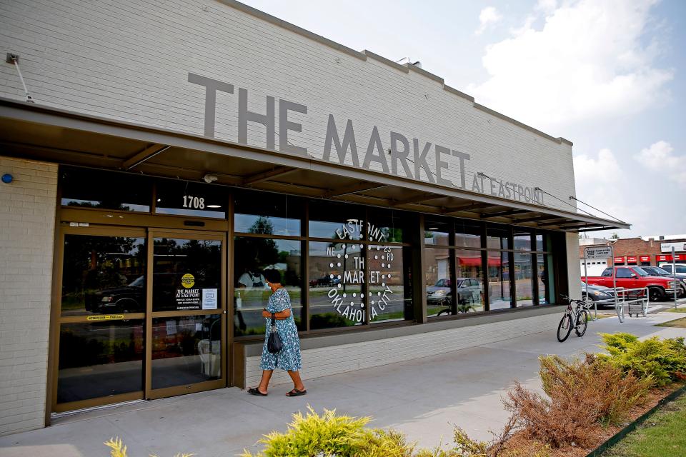 A customer enters The Market at EastPoint on July 22, 2021.