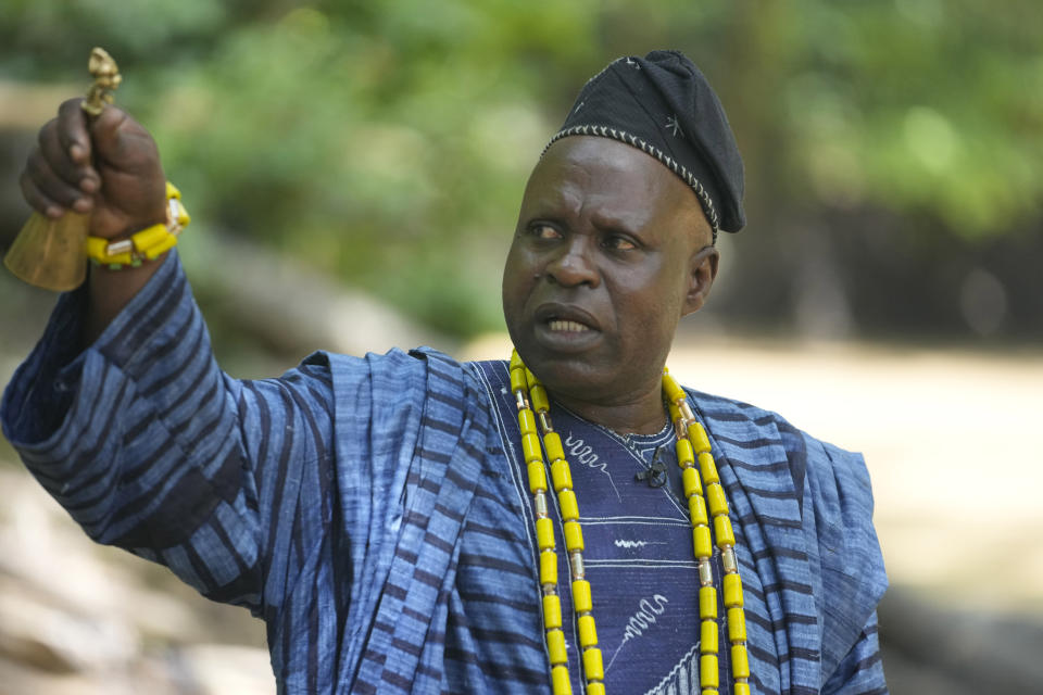 Osunyemi Ifarinu Ifabode, the Osun River chief priest, speaks during an interview in Osogbo, Nigeria, on Monday, May 30, 2022. This year, as a two-week August religious festival neared, authorities announced they had been forced to take the unusual step of telling people to stop drinking the water. "We have written to the state government, the museum on the activities of the illegal miners and for them to take actions to stop them,” Ifabode said. (AP Photo/Sunday Alamba)