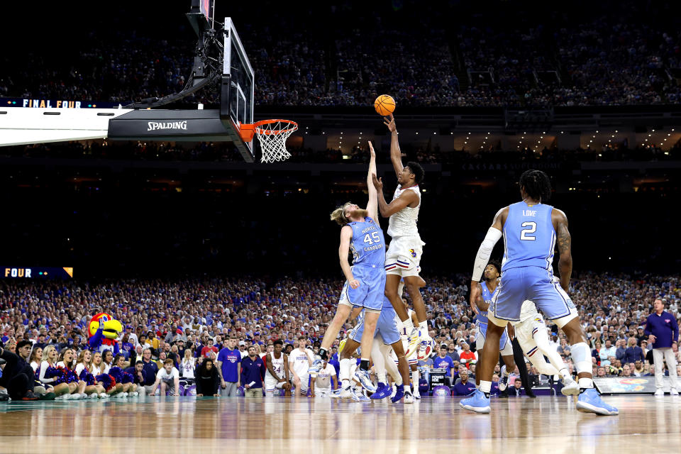 NEW ORLEANS, LOUISIANA - APRIL 04: David McCormack #33 of the Kansas Jayhawks shoots over Brady Manek #45 of the North Carolina Tar Heels during the second half of the 2022 NCAA Men's Basketball Tournament National Championship game at Caesars Superdome on April 04, 2022 in New Orleans, Louisiana. (Photo by Jamie Schwaberow/NCAA Photos via Getty Images)