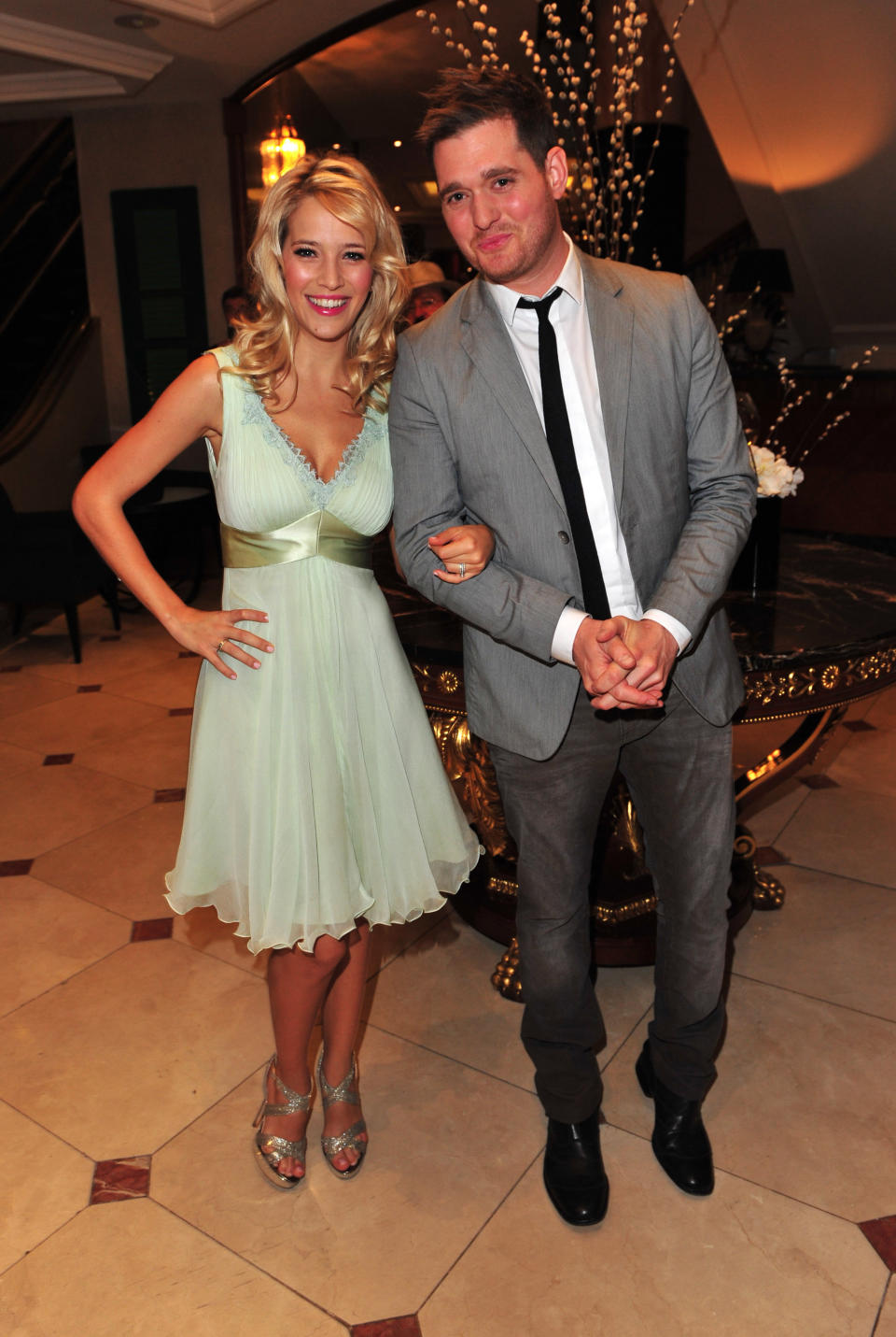 FILE - In this June 29, 2012 file photo, Argentine TV actress Luisana Lopilato, left, and husband singer Michael Buble arrive at the Nordoff Robbins 02 Silver Clef Awards at London Hilton, in London. Buble has sold millions of albums, but as he readies the release of his newest project, he’s less concerned with his future album sales, thanks to his wife’s pregnancy. “I'm nervous and excited, and truly I think it's given me great perspective,” the singer said at the music video shoot for his new single, “It's a Beautiful Day.” (Photo by Jon Furniss/Invision/AP, File)