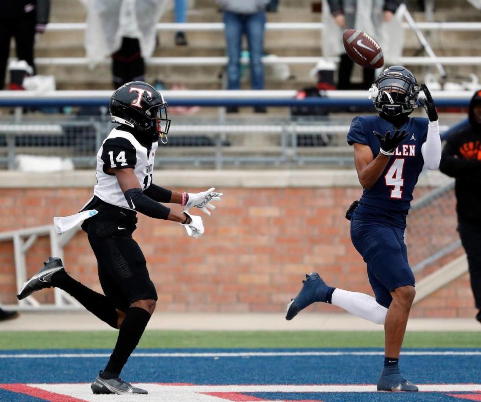 Allen wide receiver Jordyn Tyson (4) grabs a touchdown pass in front of Trinity defensive back Alton Davis (14) during a high school Class 6A Division 1 Regional playoff game at Eagle Stadium in Allen, Texas, Saturday, Nov. 27, 2021. Allen led 38-7 at the half. (Special to the Star-Telegram Bob Booth)