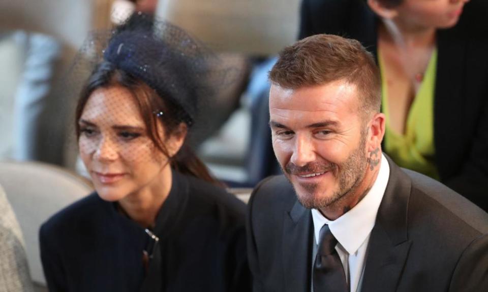 David and Victoria Beckham take their seats in St George’s Chapel