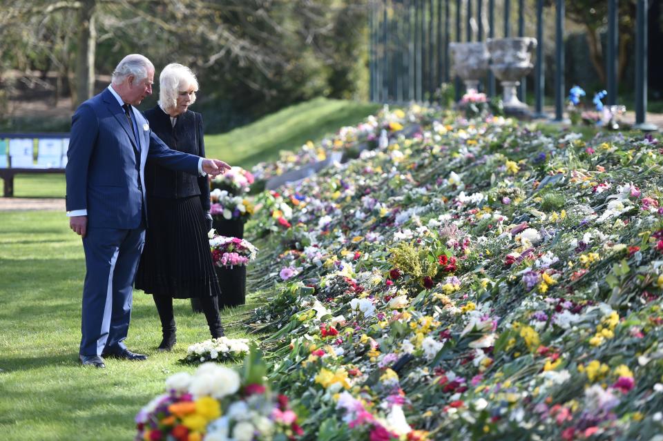 Prince Charles and the Duchess of Cornwall looking at flora tributes to the Duke of Edinburgh (Jeremy Selwyn)