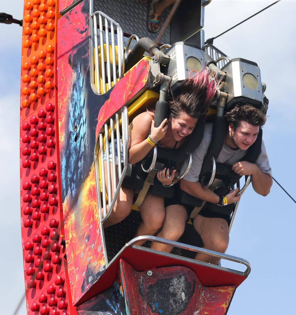 Fair-goers rode the Fire Ball on the last day of the Kentucky State Fair in Louisville, Ky. on Aug. 29 2021.  