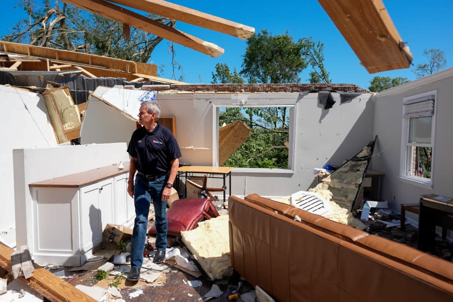 Gov. Bill Lee surveys a storm-damaged home along Blackburn Lane, Thursday, May 9, 2024, in Columbia, Tenn. (AP Photo/George Walker IV)