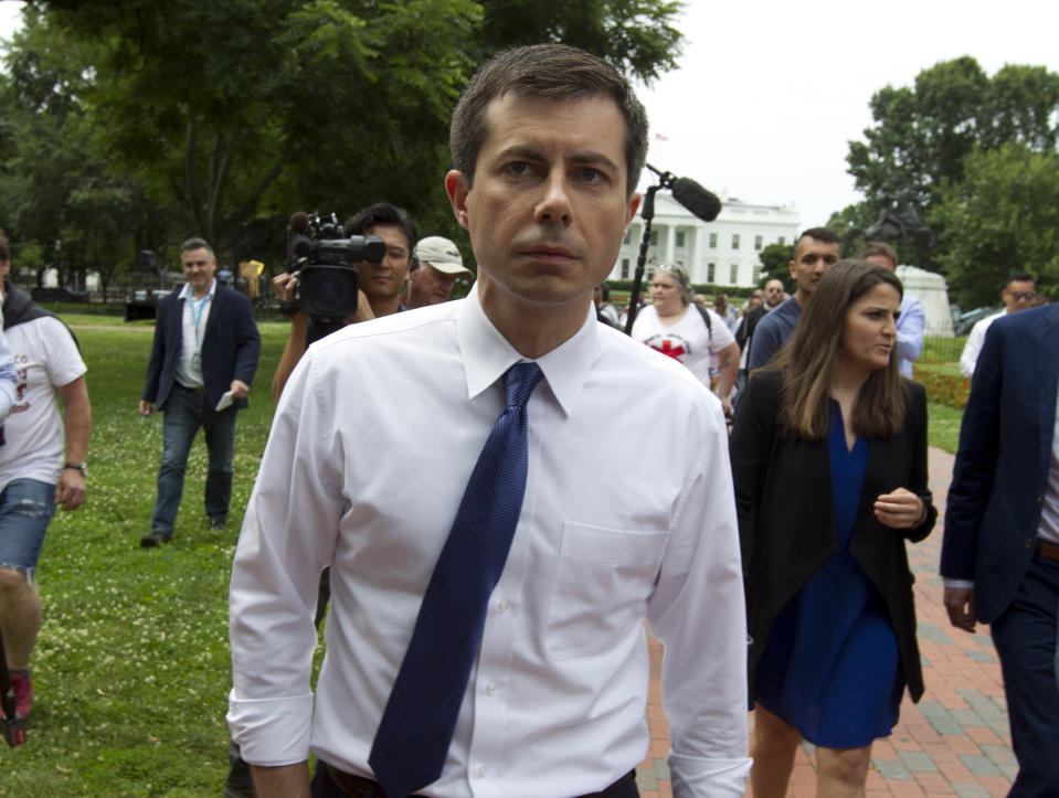 Democratic presidential candidate Mayor Pete Buttigieg, walks to attend a rally protesting against President Donald Trump policies outside of the White House in Washington, Wednesday, June 12, 2019. (AP Photo/Jose Luis Magana)