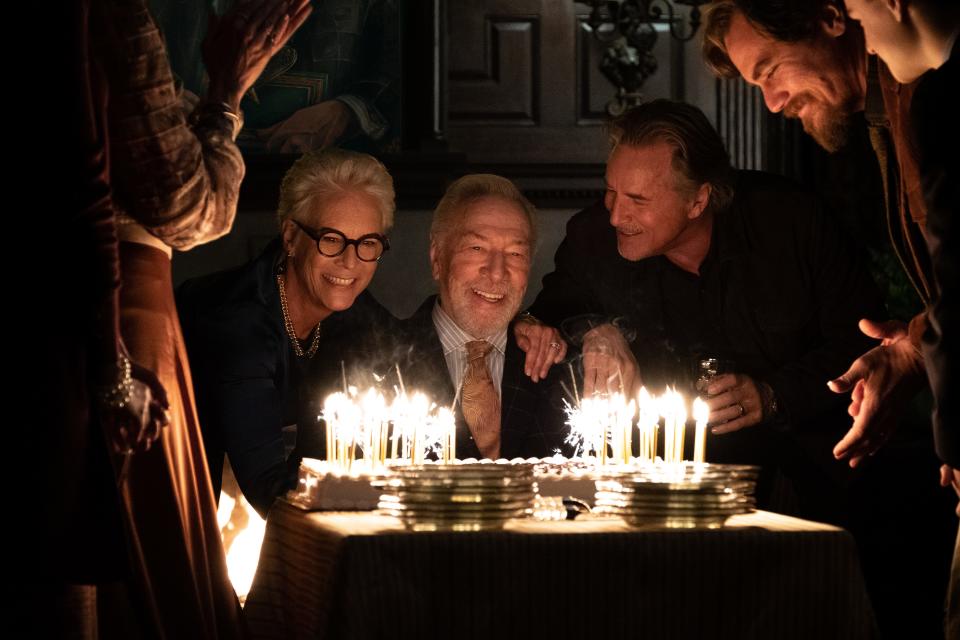 Wealthy mystery writer Harlan Thrombey (Christopher Plummer, center) celebrates his birthday with family members (Jamie Lee Curtis, Don Johnson and Michael Shannon) before turning up dead in "Knives Out."