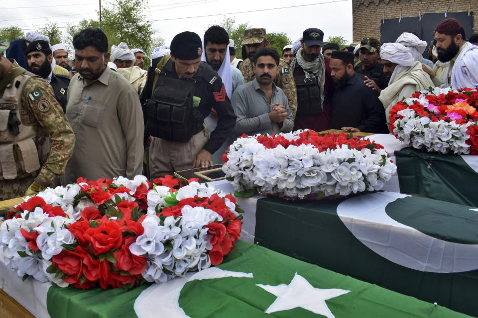 Security officials and others attend funeral prayer of police officer, who was killed in a bomb blast, in Lake Mart, a Pakistani town of Khyber Pakhtunkhwa province bordering Afghanistan, Thursday, March 30, 2023. Taliban militants in a pair of attacks killed four police officers by targeting a police vehicle with a roadside bomb and wounded six in an attack on a police station in northwest Pakistan early Thursday, (AP Photo/G.A. Marwat)