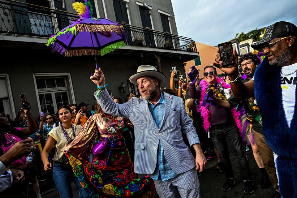 Revelers dance in the streets of the French Quarter during the Mardi Gras Festival in New Orleans, Louisiana, on February 20, 2023.