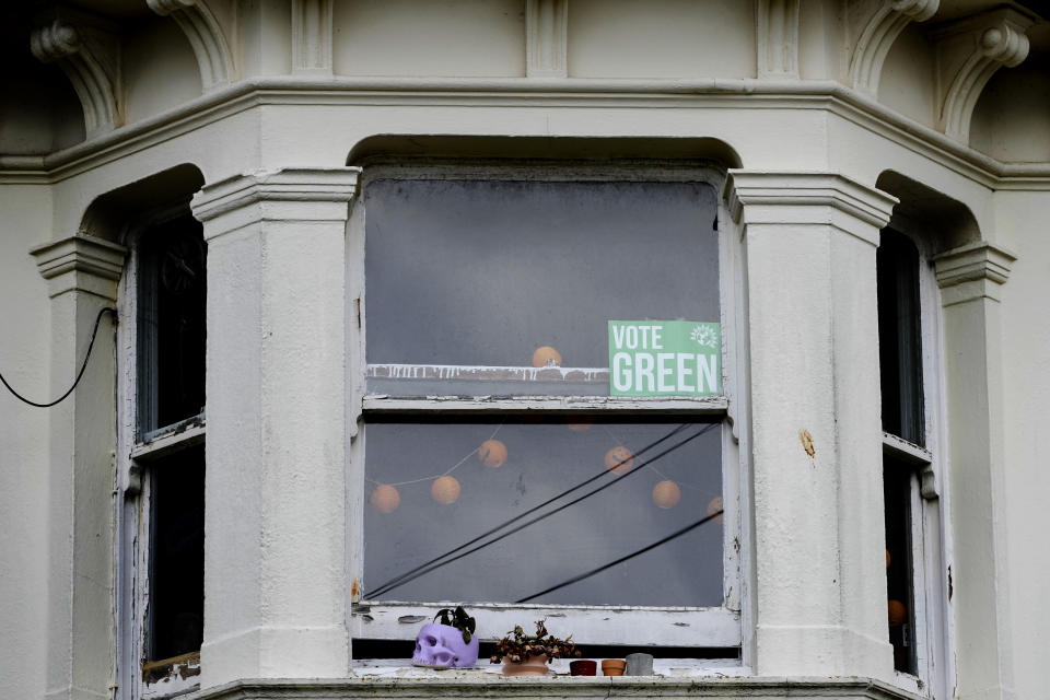 A Vote Green poster is displayed in a window of a house in the Round Hill Ward in Brighton, East Sussex, England, Wednesday, June 12, 2024. There’s lots of talk of change in Britain’s election campaign, but little talk about climate change. The U.K.’s July 4 vote to choose a new government comes after one of the wettest and warmest winters on record, part of trends scientists attribute to global warming. (AP Photo/Kirsty Wigglesworth)