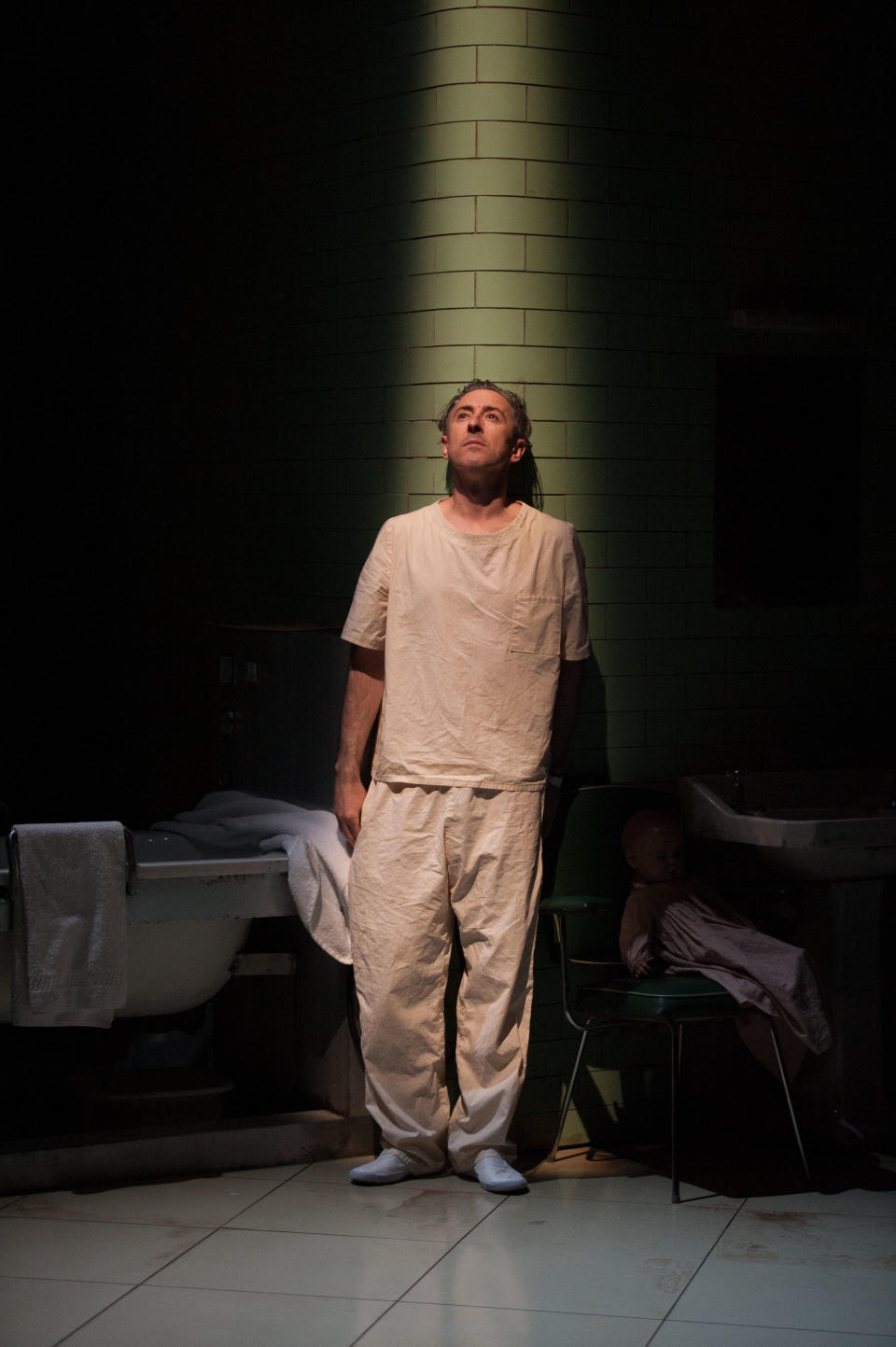 This undated theater image released by National Theatre of Scotland shows Alan Cumming in "Macbeth." In the play, Cumming appears as a patient in a white-tiled mental hospital for whom the plot of "Macbeth is sort of a schizophrenic nightmare. The production, which started in Scotland in mid-June before coming to New York for the next few days as part of the Lincoln Center Festival. (AP Photo/National Theatre of Scotland, Manuel Harlan)