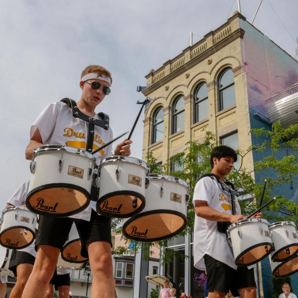 Members of the Sheboygan North Drum Line keep the beat during the Sheboygan Brat Days parade, Saturday, August 7, 2021, in Sheboygan, Wis.