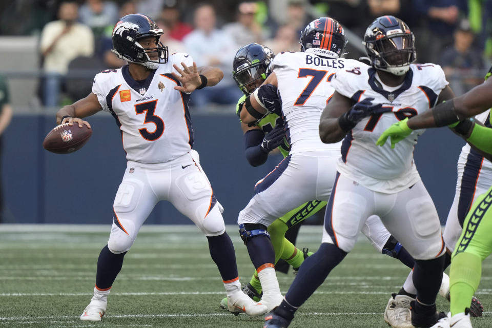 Denver Broncos quarterback Russell Wilson (3) passes for a touchdown against the Seattle Seahawks during the first half of an NFL football game, Monday, Sept. 12, 2022, in Seattle. (AP Photo/Stephen Brashear)