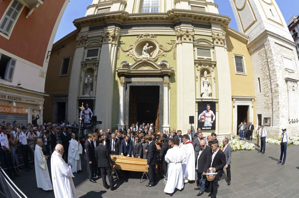 Friends, relatives and Formula One drivers gather around the coffin of late Marussia F1 driver Jules Bianchi during the funeral ceremony at the Sainte Reparate Cathedral in Nice, France, July 21, 2015. Bianchi, 25, died in hospital in Nice on Friday, nine months after his crash at Suzuka in Japan and without regaining consciousness. REUTERS/Jean-Pierre Amet