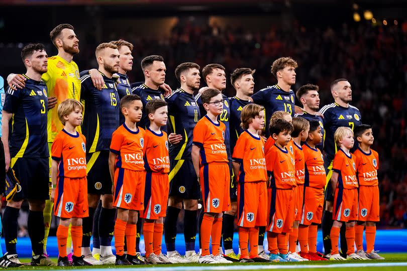 Andy Robertson of Scotland, Scotland goalkeeper Angus Gunn, Ryan Porteous of Scotland, Scott McTominay of Scotland, Lawrence Shankland of Scotland, Ryan Christie of Scotland, Kieran Tierney of Scotland, Jack Hendry of Scotland, Billy Gilmour of Scotland and John McGinn of Scotland line up prior to the friendly match between Netherlands and Scotland at Johan Cruyff Arena