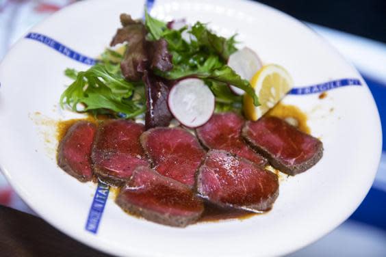 A plate of roasted whale at Kujirakan, or Whale House, restaurant. (Shiho Fukada/The Washington Post)