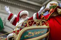 A man dressed as Santa Claus waves as he rides on his float down Central Park West during the 88th Macy's Thanksgiving Day Parade in New York November 27, 2014. REUTERS/Eduardo Munoz (UNITED STATES - Tags: SOCIETY)