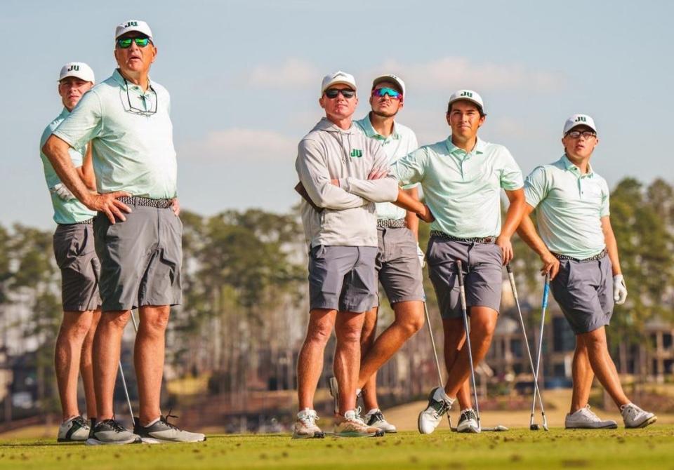 Jacksonville University coach Mike Blackburn (second from the left) watched his players post their best finish of the spring recently at the UNC-Wilmington Seahawk Invitational.