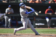 Texas Rangers' Andy Ibanez connects for a two-run home run against the Baltimore Orioles in the fourth inning of a baseball game Sunday, Sept. 26, 2021, in Baltimore. (AP Photo/Gail Burton)