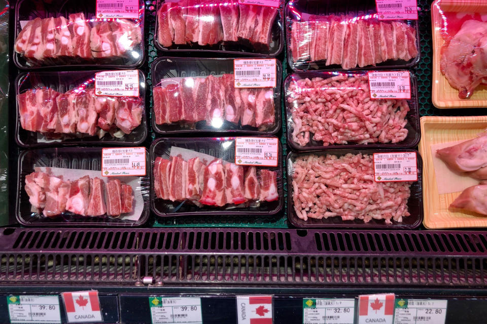 Packs of Canadian pork are displayed for sale at a supermarket in Beijing, Tuesday, June 18, 2019. China will halt imports from a Canadian company after food safety issues were detected in one batch of pork, the Xinhua state news agency reported Tuesday, a move likely to fuel further speculation that China is retaliating against Canada after it arrested a Chinese tech executive. (AP Photo/Andy Wong)