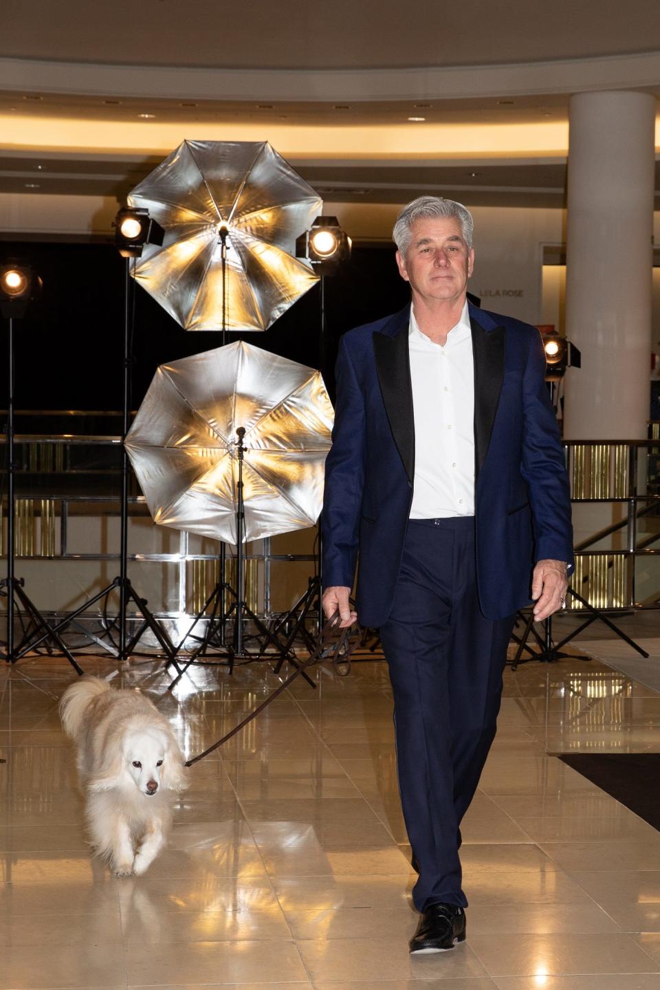 Kelly Dougherty and Beau walk at the 11th annual Men of the Desert benefit for Animal Samaritans on Dec. 4, 2020.