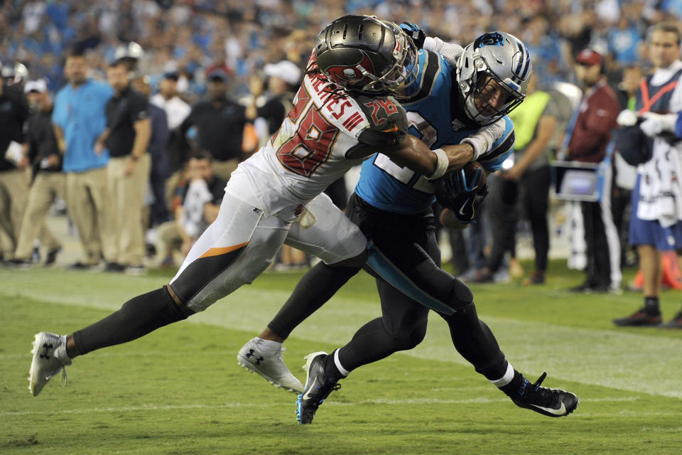 Tampa Bay Buccaneers cornerback Vernon III Hargreaves (28) tackles Carolina Panthers running back Christian McCaffrey late in the second half of an NFL football game in Charlotte, N.C., Friday, Sept. 13, 2019. Tampa Bay won 20-14. (AP Photo/Mike McCarn)